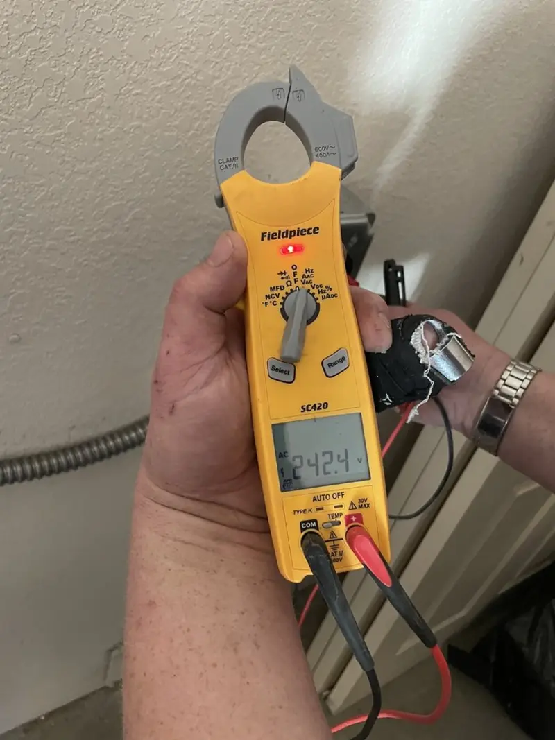 Voltage testing with clamp meter during Generator Installation in Oak Creek